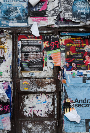 SZCZECIN, WEST POMERANIAN / POLAND - 2018: The walls of the building are covered with posters and announcementsのeditorial素材