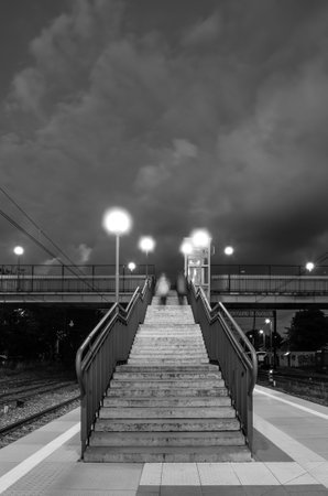 KOLOBRZEG, WEST POMERANIAN / POLAND - 2018: Railway station - exit from the bridge to the bridgeのeditorial素材