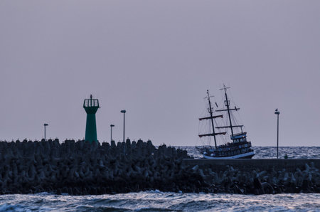 KOLOBRZEG, WEST POMERANIAN / POLAND - 2018: A cruise ship on the road over the sea coast