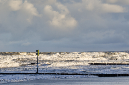 STORM AT SEA - Blackboard with danger warning and wavesの写真素材