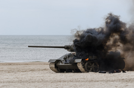 TANK ON THE SEA BEACH - Destroyed vehicle in Kolobrzeg.の写真素材