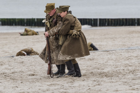 KOLOBRZEG, WEST POMERANIAN / POLAND - 2019: Reconstruction of battle for Kolobrzeg - Female military...
