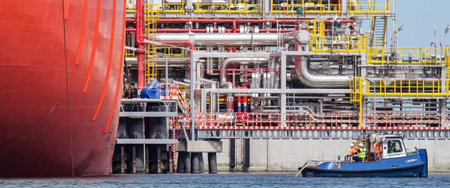 SWINOUJSCIE, WEST POMERANIAN / POLAND - 2018: Mooring of a large gas tanker to a LNG terminal