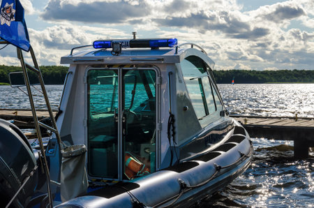 SZCZECINEK, WEST POMERANIAN / POLAND - 2019: A police boat prepared for activities on the lakeのeditorial素材