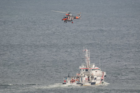 GDYNIA, POMERANIA REGION / POLAND - 2019: A sea search and rescue boat and marine rescue helicopter