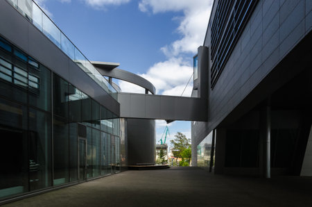 GDYNIA, POMERANIAN REGION / POLAND - 2019: Architecture of a modern building with seaport infrastructure in the backgroundのeditorial素材