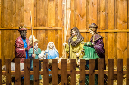 POZNAN / POLAND - 2019: A wooden crib with a scene of the nativity of Jesusのeditorial素材