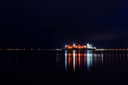 LNG TANKER AT NIGHT - A beautiful ship at the gas terminalの写真素材