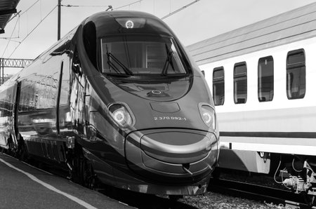 KOLOBRZEG, WEST POMERANIAN / POLAND - 2018: An express train stands at the station by the platformのeditorial素材