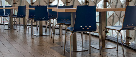 POZNAN / POLAND - 2019: Chairs and tables at a train stationのeditorial素材