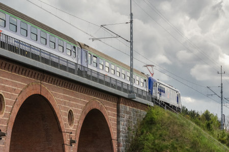 KARLINO, WEST POEMARANIAN / POLAND - 2020: The express train travels through the viaduct along the railway routeのeditorial素材
