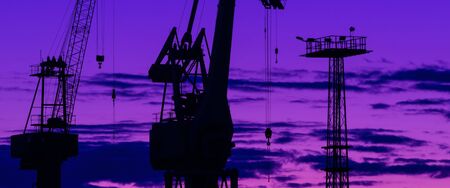 PORT CRANE - A device for moving heavy loads in the port and shipyard at sunrise