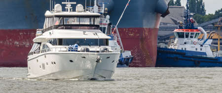 MOTORBOAT - A luxurious recreational boat is sailing out to sea