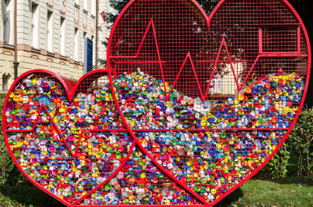 BIALOGARD, WEST POMERANIAN / POLAND -2020: Baskets with plastic caps from bottles collected in a charity action and promoting the recovery of materials for recyclingのeditorial素材