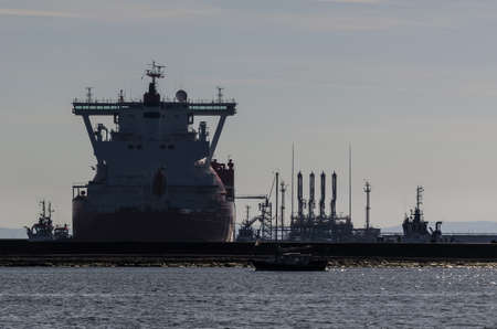 LNG TANKER - Ship is maneuvering to moor at the gas terminalの写真素材