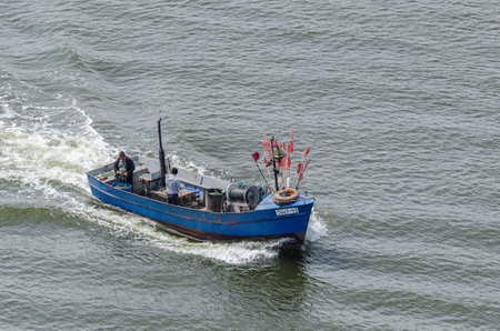 SWINOUJSCIE, WEST POMERANIAN / POLAND - 2020: The fishermen set out to sea on their classic boat to...