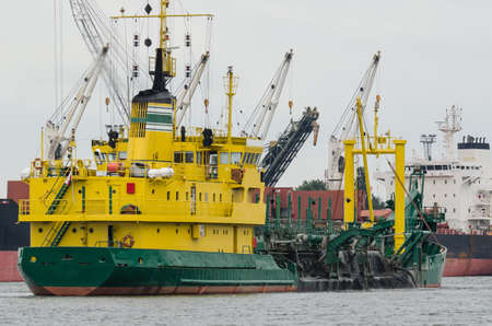 HOPPER DREDGER - A specialized vessel works on the fairway in the port
