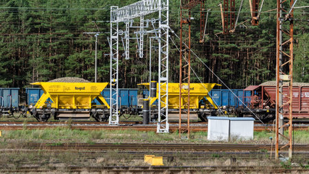 SWINOUJSCIE, WEST POMERANIAN / POLAND - 2020: Wagons on a maneuvering siding with a load of aggregates for the renovation of the railway lineのeditorial素材