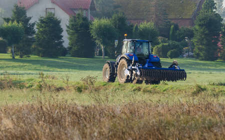 TRACTOR - The agricultural machine goes to work in the field