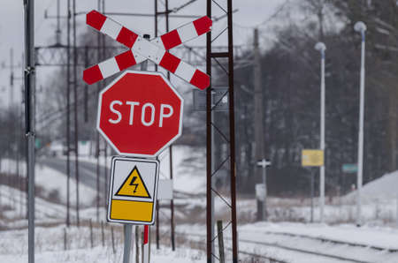 STOP SIGN AND St ANDREWS CROSS - Road sign at a railroad crossingの写真素材