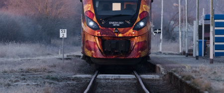 KOLOBRZEG, WEST POMERANIAN - POLAND - 2021: A modern hybrid passenger train in a small village stationのeditorial素材
