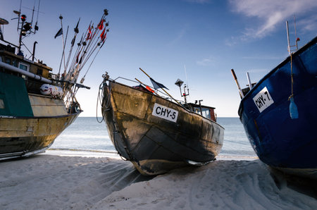 CHLOPY, WEST POMERANIAN - POLAND - 2021: Fishing boats pulled onto the sea shoreのeditorial素材