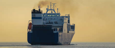 MERCHANT VESSEL - Ship sails to the seaの写真素材