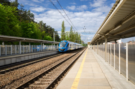 MIEDZYZDROJE, WEST POMERANIAN - POLAND - 2021: A modern regional passenger train starts its journey from the railway stationのeditorial素材