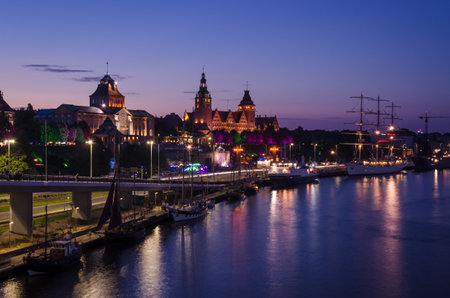SZCZECIN, WEST POMERANIAN - POLAND - 2021: Sunset over the National Museum, the Province Office and...