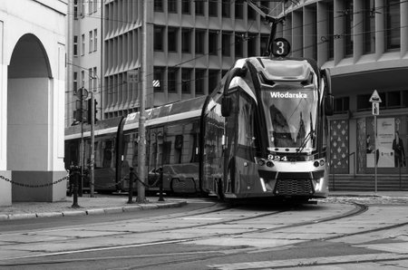 POZNAN - POLAND - 2021: A modern tram goes through the streets of the city