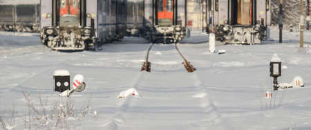 SNOWSTORM - Old fence mesh in the pasturage in a winter landscapeの写真素材