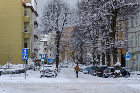 KOLOBRZEG, WEST POMERANIAN - POLAND - 2021: Traffic on the streets of a snow covered winter cityのeditorial素材