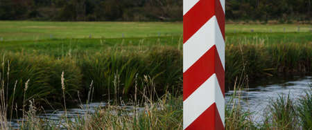 STATE BORDER POST - The Polish border is marked with posts in national colorsの写真素材