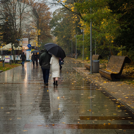KOLOBRZEG, WEST POMERANIAN - POLAND - 2021: Fall rain on the promenade of resortのeditorial素材