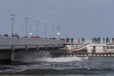KOLOBRZEG, WEST POMERANIAN - 2022: Pier and hurricane on the sea coastのeditorial素材
