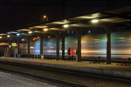 RAILWAY - Departure of passenger train from the platform at stationの写真素材