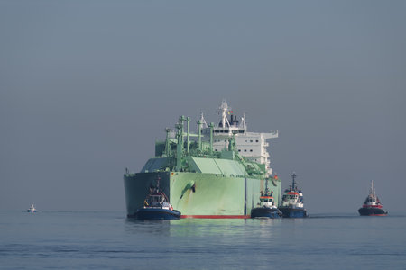 LNG TANKER - The ship sails to port assisted by tugsの写真素材