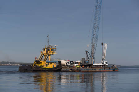 PUSHER TUG AND BARGE - A floating platform with crane for hydrotechnical works and concrete mixer...