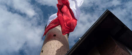 STATE FLAG - Flag of Poland at the lighthouse in Swinoujscieの写真素材