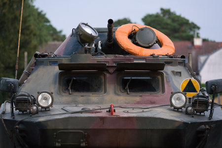 COMBAT RECONNAISSANCE / PATROL VEHICLE - A camouflage scout on a country roadの写真素材