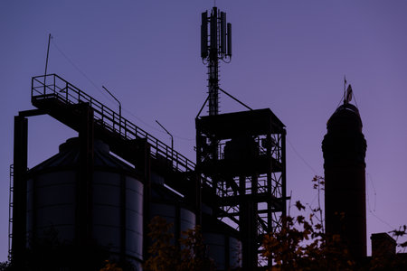INDUSTRIAL LANDSCAPE - Storage silos and the old chimney of the brewery in Polczyn Zdrojの写真素材