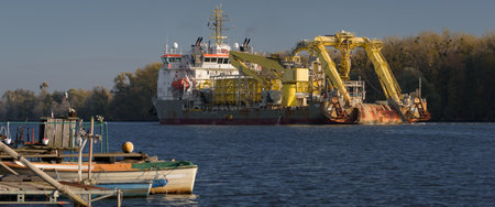 SZCZECIN, WEST POMERANIAN / POLAND - 2022: Cable laying vessel flows down bay canal on a cruise out to seaのeditorial素材