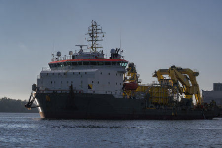 MARITIME ENGINEERING - Cable laying vessel is sailing along the port channel to the seaの写真素材