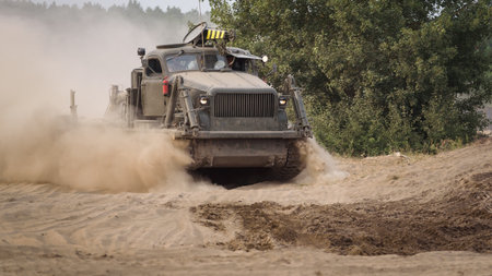 BORNE SULINOWO, WEST POMERANIAN - POLAND - 2022: Military high speed dozer for sapper and engineering work is driving in the off-roadのeditorial素材