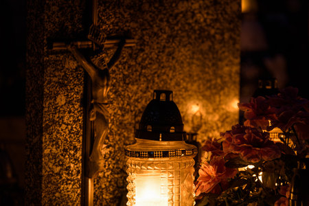 CEMETERY - Grave candles on tombstones at the burial site of the deadの写真素材