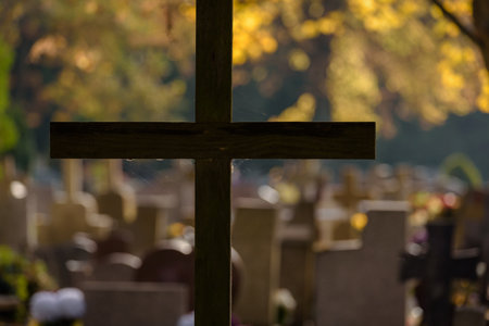 CEMETERY - Old wooden crucifix and tombstones at burial site of the dead