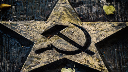 KOLOBRZEG, WEST POMERANIAN - POLAND - 2022: WAR GRAVES - Symbols of the Soviet Union on the...