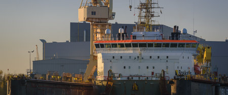 SZCZECIN, WEST POMERANIAN - POLAND - 2022: Cable laying vessel in the shipyard floating repair dockのeditorial素材