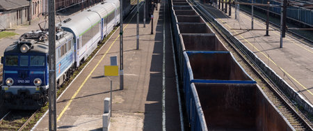 BIALOGARD, WEST POMERANIAN - POLAND - 2022: Express train and freight train at the railway station
