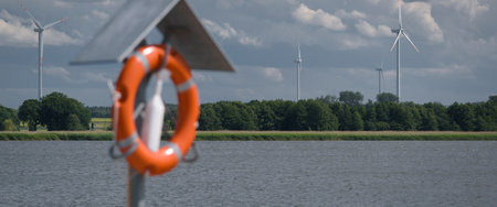 LAKE - A water landscape with a lifebuoy in the foreground